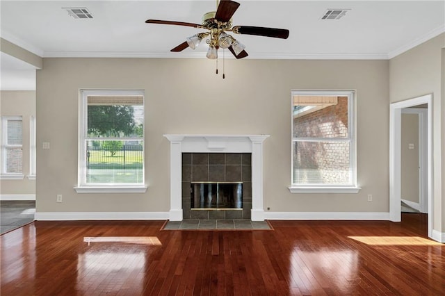 147 Jesuit Bend Dr, Belle Chasse, LA 70037 - unfurnished living room featuring wood-type flooring, a ceiling fan, ornamental molding, and a fireplace