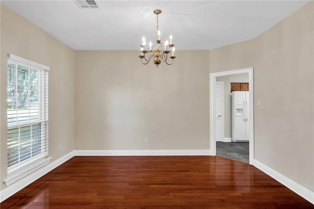 147 Jesuit Bend Dr, Belle Chasse, LA 70037 - spare room with a chandelier and wood finished floors