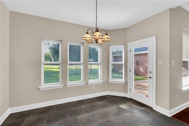 147 Jesuit Bend Dr, Belle Chasse, LA 70037 - unfurnished dining area with a chandelier and dark stone finish floors