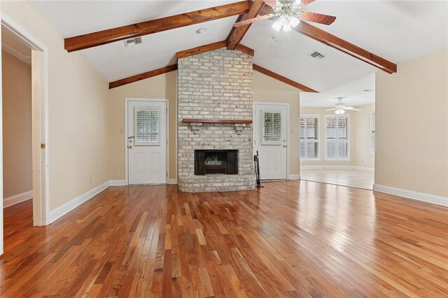 3632 N Hullen St, Metairie, LA 70002 - unfurnished living room with ceiling fan, light wood-style flooring, and a brick fireplace