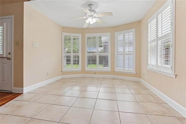 3632 N Hullen St, Metairie, LA 70002 - empty room featuring plenty of natural light, ceiling fan, and light tile patterned floors