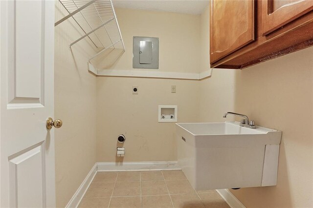 3632 N Hullen St, Metairie, LA 70002 - laundry area featuring cabinet space, hookup for a washing machine, electric panel, light tile patterned flooring, and electric dryer hookup