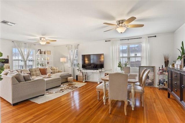 665254 General Diaz St, New Orleans, LA 70124 - living room with ceiling fan, healthy amount of natural light, and light wood-type flooring