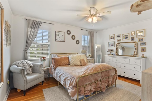 665254 General Diaz St, New Orleans, LA 70124 - bedroom with wood finished floors, crown molding, and a ceiling fan