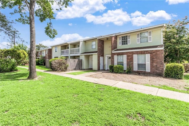 101 Wilbourn Blvd Unit 102, Lafayette, LA 70506 - view of property with a front yard and brick siding