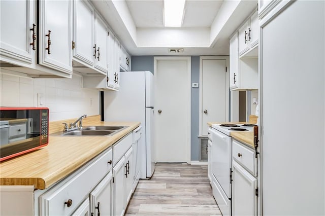 101 Wilbourn Blvd Unit 102, Lafayette, LA 70506 - kitchen with electric stove, black microwave, light wood finished floors, backsplash, and light countertops