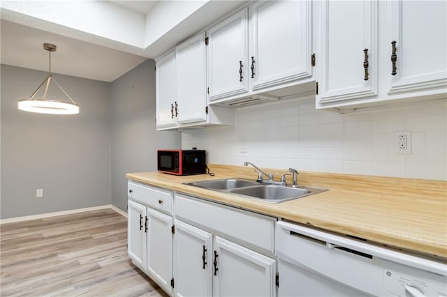 101 Wilbourn Blvd Unit 102, Lafayette, LA 70506 - kitchen with black microwave, white cabinetry, decorative backsplash, and light countertops