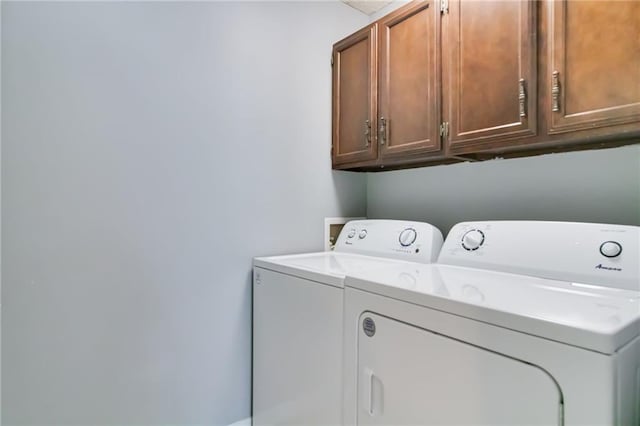 101 Wilbourn Blvd Unit 102, Lafayette, LA 70506 - laundry area featuring cabinet space and washing machine and clothes dryer