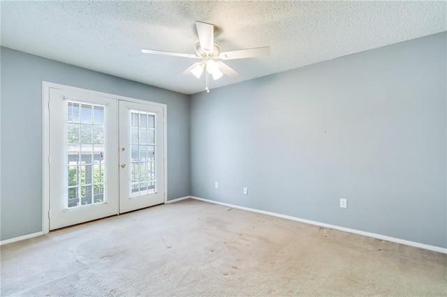 101 Wilbourn Blvd Unit 102, Lafayette, LA 70506 - unfurnished room with french doors, carpet flooring, a textured ceiling, and a ceiling fan