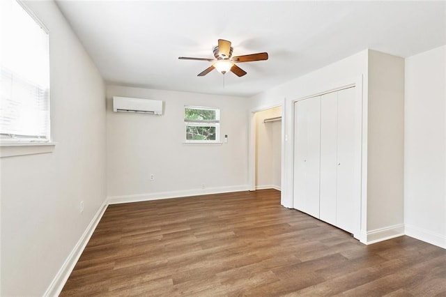 8426 Green St, New Orleans, LA 70118 - unfurnished bedroom featuring an AC wall unit, wood finished floors, and ceiling fan
