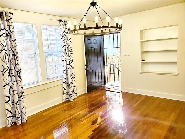 21416 N 12th St, Baton Rouge, LA 70802 - entryway with a chandelier, wood finished floors, healthy amount of natural light, and ornamental molding