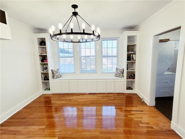 21416 N 12th St, Baton Rouge, LA 70802 - unfurnished dining area featuring a chandelier, light wood-style flooring, and crown molding