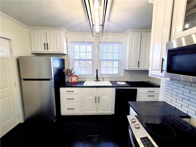 21416 N 12th St, Baton Rouge, LA 70802 - kitchen with appliances with stainless steel finishes, dark countertops, white cabinetry, backsplash, and ornamental molding