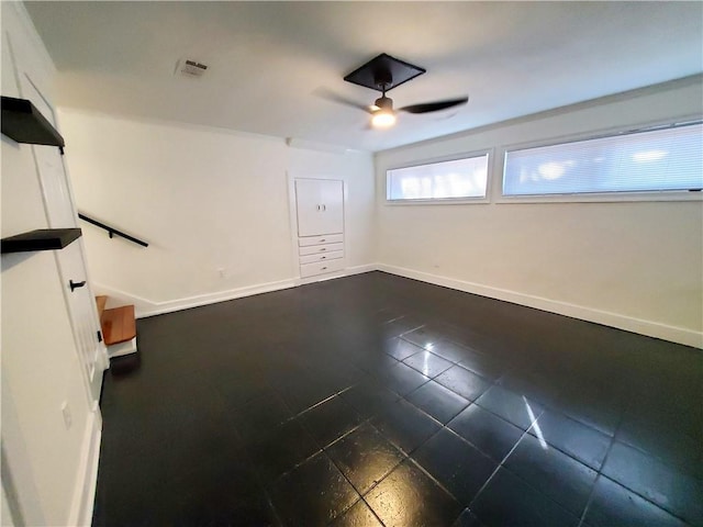 21416 N 12th St, Baton Rouge, LA 70802 - empty room featuring a ceiling fan and dark tile patterned flooring