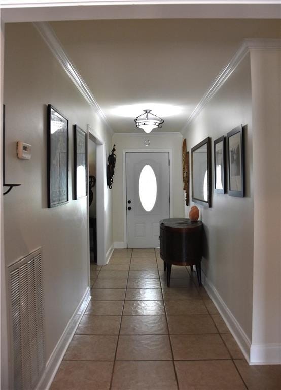 5501 Chatham Dr, New Orleans, LA 70122 - entryway with ornamental molding and light tile patterned flooring