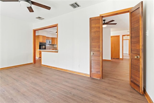 1709 Francis Ave, Metairie, LA 70003 - unfurnished room with ceiling fan and light wood-style flooring