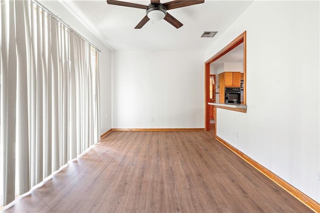 1709 Francis Ave, Metairie, LA 70003 - unfurnished room featuring a ceiling fan and wood finished floors