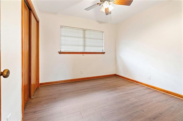 1709 Francis Ave, Metairie, LA 70003 - unfurnished bedroom featuring wood finished floors, a closet, and a ceiling fan