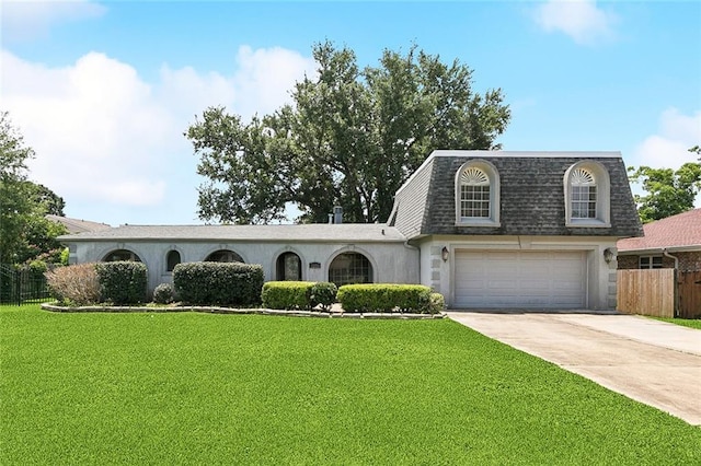 4000 Kawanee Ave, Metairie, LA 70002 - view of front of property with a shingled roof, mansard roof, concrete driveway, an attached garage, and stucco siding