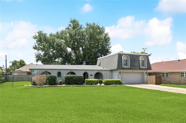 4000 Kawanee Ave, Metairie, LA 70002 - view of front of home featuring an attached garage, concrete driveway, mansard roof, and a shingled roof