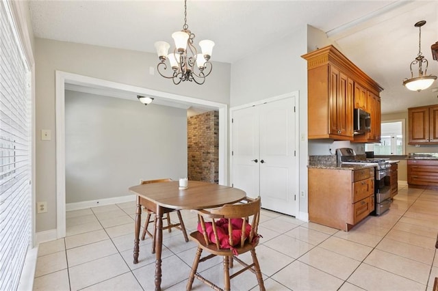 4000 Kawanee Ave, Metairie, LA 70002 - dining room with light tile patterned floors and a chandelier