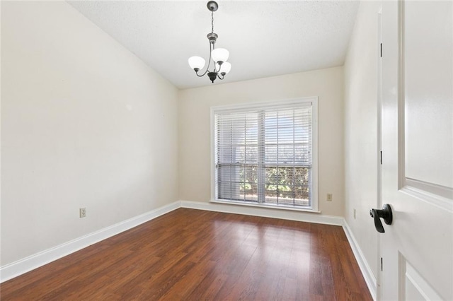 4000 Kawanee Ave, Metairie, LA 70002 - empty room featuring a chandelier and wood finished floors