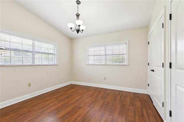 4000 Kawanee Ave, Metairie, LA 70002 - empty room featuring a chandelier, healthy amount of natural light, and wood finished floors