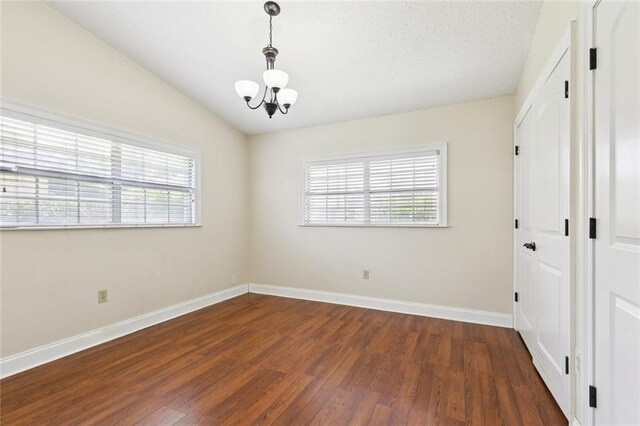 4000 Kawanee Ave, Metairie, LA 70002 - empty room featuring a chandelier, healthy amount of natural light, and wood finished floors