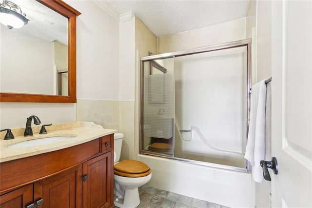 4000 Kawanee Ave, Metairie, LA 70002 - full bathroom with vanity, shower / bath combination with glass door, a textured ceiling, and ornamental molding