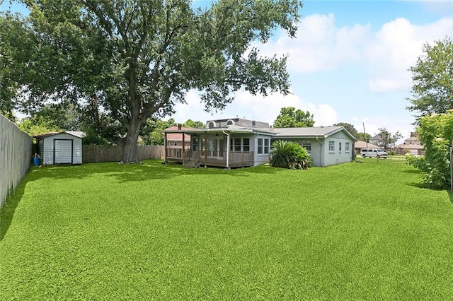 4000 Kawanee Ave, Metairie, LA 70002 - fenced backyard with a storage shed, a sunroom, and a wooden deck