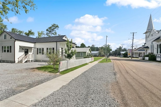 702 Pine St, Madisonville, LA 70447 - view of asphalt street with street lighting and sidewalks