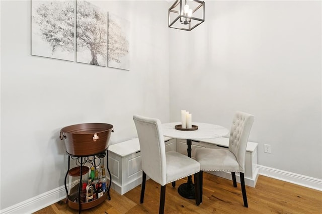 702 Pine St, Madisonville, LA 70447 - dining space featuring a chandelier and wood finished floors
