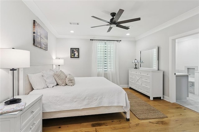 702 Pine St, Madisonville, LA 70447 - bedroom with light wood finished floors, ornamental molding, a ceiling fan, and recessed lighting