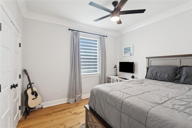 702 Pine St, Madisonville, LA 70447 - bedroom featuring light wood-style flooring, ceiling fan, and crown molding