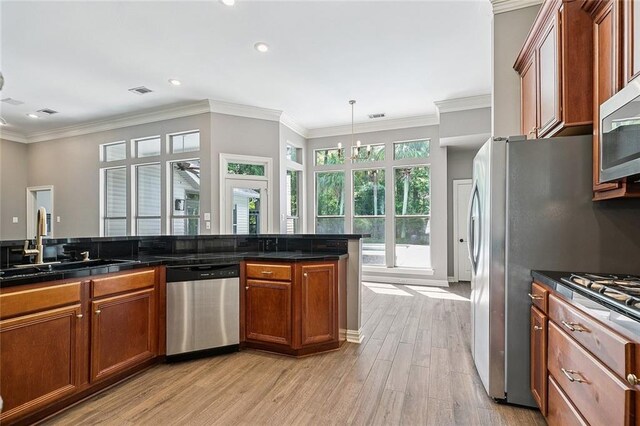 230 Delta Dr, Mandeville, LA 70448 - full bathroom with two vanities, crown molding, a chandelier, a bath, and a shower stall