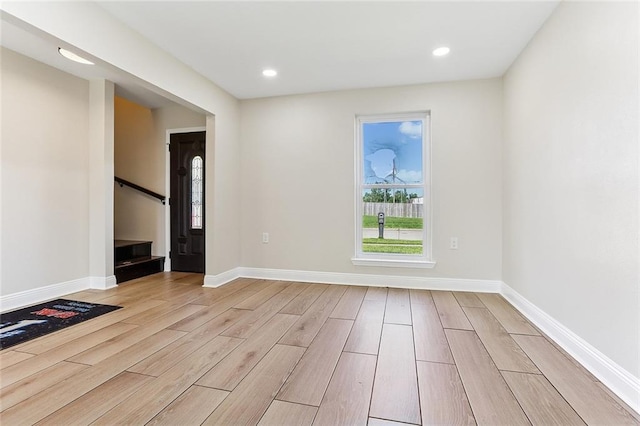 3028 Concordia Dr, La Place, LA 70068 - spare room with light wood-style floors, recessed lighting, and stairs