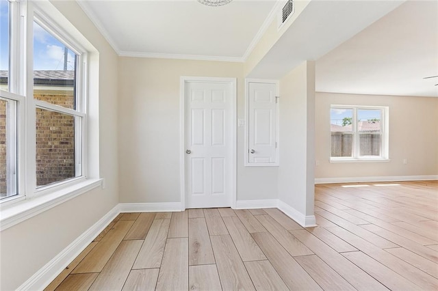3028 Concordia Dr, La Place, LA 70068 - spare room with light wood-style flooring and crown molding