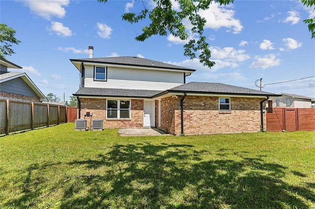 3028 Concordia Dr, La Place, LA 70068 - rear view of property featuring brick siding, a fenced backyard, and a patio