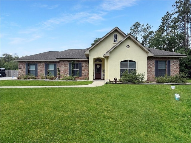 201 Stephanie Ln, Covington, LA 70435 - ranch-style home featuring a front yard, brick siding, and roof with shingles