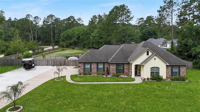 201 Stephanie Ln, Covington, LA 70435 - ranch-style house featuring a shingled roof, brick siding, and stucco siding