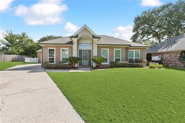 178 Colony Rd, Belle Chasse, LA 70037 - ranch-style house with brick siding and a shingled roof