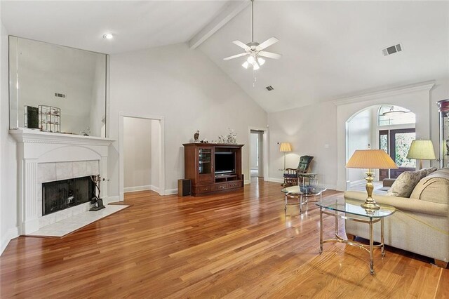 178 Colony Rd, Belle Chasse, LA 70037 - living room featuring high vaulted ceiling, a fireplace, beam ceiling, ceiling fan, and wood finished floors