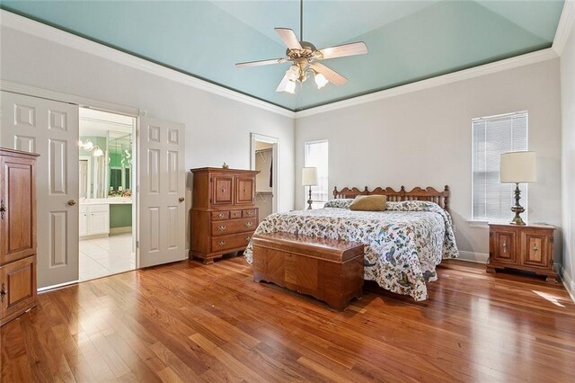 178 Colony Rd, Belle Chasse, LA 70037 - bedroom with wood finished floors, ornamental molding, ensuite bathroom, and ceiling fan