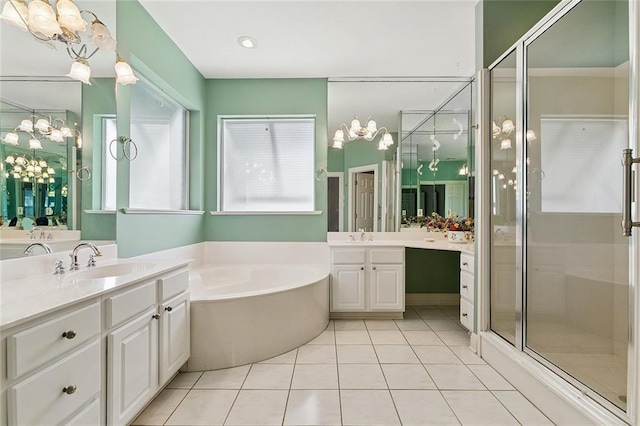 178 Colony Rd, Belle Chasse, LA 70037 - full bath with a chandelier, a garden tub, two vanities, a shower stall, and tile patterned flooring