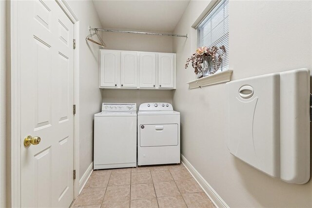 178 Colony Rd, Belle Chasse, LA 70037 - washroom featuring cabinet space, washer and clothes dryer, and light tile patterned floors