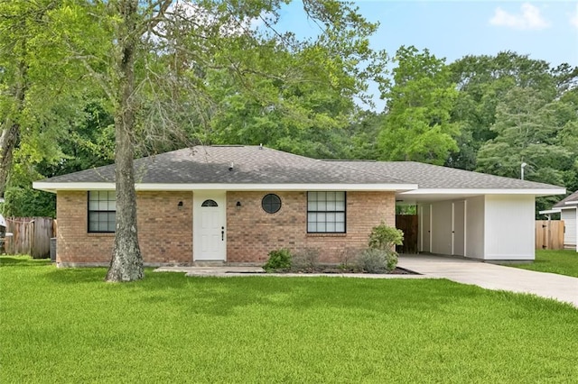 205 Timber Ridge Dr, Slidell, LA 70460 - view of front of house featuring concrete driveway, a carport, brick siding, and roof with shingles