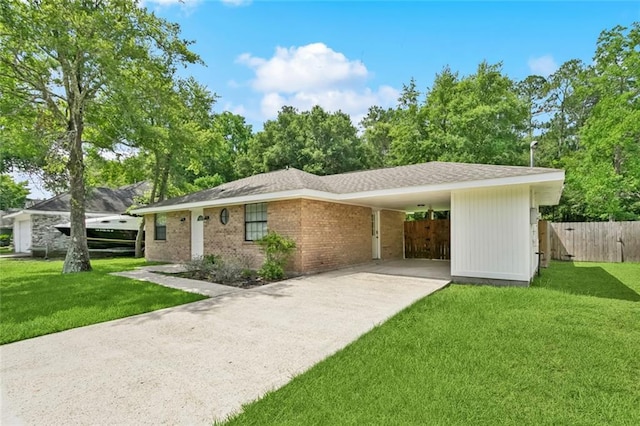 205 Timber Ridge Dr, Slidell, LA 70460 - view of front of property with concrete driveway, a carport, and brick siding