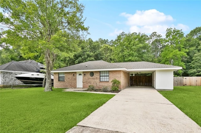205 Timber Ridge Dr, Slidell, LA 70460 - ranch-style home featuring concrete driveway, an attached carport, and brick siding