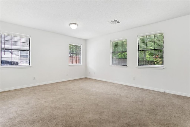 205 Timber Ridge Dr, Slidell, LA 70460 - carpeted spare room with a textured ceiling