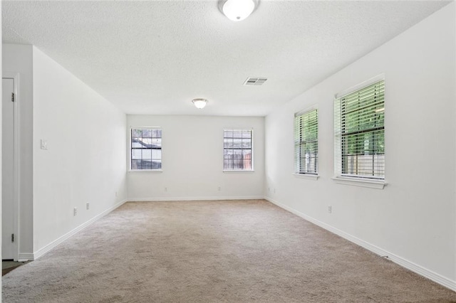205 Timber Ridge Dr, Slidell, LA 70460 - empty room with a textured ceiling and carpet flooring